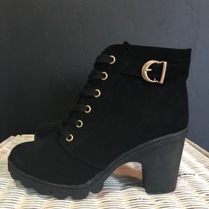 Woman’s black suede boots